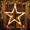 A festive Christmas window decoration featuring a large illuminated star. Produktbild-Vorschau