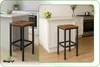 A kitchen counter with bar stools and fruit. Podgląd zdjęcia produktu