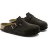A pair of brown Birkenstock Boston clogs on a white background. Produktbild-Vorschau