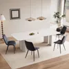 A modern dining room with a white table and chairs. Voir les images du produit