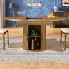 A dining room scene with a round extendable table as the focal point, surrounded by chairs and a rug. Anteprima dell’immagine prodotto