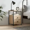 A bedside table with drawers next to a bed. Náhled obrázku produktu