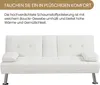 A white sofa with chrome legs is shown against a white background. Text overlays describe its comfort and features. Produktbild-Vorschau