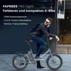 A man is posing with a blue foldable electric bike in an urban setting. Náhled obrázku produktu