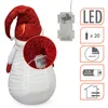 A close-up of a fabric snowman decoration with a red glitter hat and white body, next to a diagram of its LED light features. Voir les images du produit