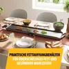 A table set for a meal with a grill plate in the center, surrounded by food and place settings. Voir les images du produit