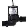 A black solar water pump with a label showing specifications. Voir les images du produit
