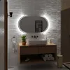 A modern bathroom vanity with a sink, mirror, and accessories. Produktbild-Vorschau