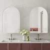 A modern bathroom vanity with two sinks and arched mirrors. Náhled obrázku produktu