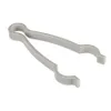 A light gray plastic tool with two opposing arms, designed for gripping or opening objects. Podgląd zdjęcia produktu