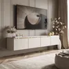 A modern living room with a wall-mounted TV cabinet and a large television. Produktbild-Vorschau