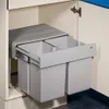 A pull-out trash bin system with two compartments installed inside a kitchen cabinet. Produktbild-Vorschau