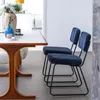 A dining table with two chairs in a room. Voir les images du produit