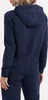A person wearing a navy blue Nike hoodie and matching sweatpants, shown from the back. Anteprima dell’immagine prodotto
