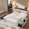 A bedroom scene featuring a bed with storage drawers and a headboard with integrated charging ports. Náhled obrázku produktu