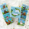 A collection of children's books arranged around a central box set. Produktbild-Vorschau