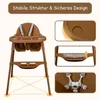 A brown high chair with safety features highlighted in inset images. Produktbild-Vorschau