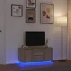 A modern living room scene featuring a TV stand with a television and decorative items, illuminated by ambient lighting. Náhled obrázku produktu