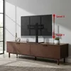 A TV stand with a TV on it, placed on a wooden cabinet in a room. Produktbild-Vorschau