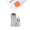 A refill pouch is pouring liquid soap into a silver automatic soap dispenser. Produktbild-Vorschau