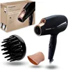 A black Panasonic hair dryer with rose gold accents, along with its attachments and packaging, is displayed against a white background. Anteprima dell’immagine prodotto