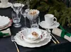 A festive table setting with Christmas-themed tableware and decorations. Produktbild-Vorschau