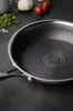 A close-up shot of a frying pan with a honeycomb pattern on its surface. Náhľad obrázku produktu