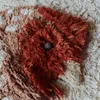 A close-up view of a textured rug, possibly part of a larger design or a decorative item. Voir les images du produit