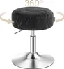 A black swivel stool with a silver base and adjustable height mechanism. Náhled obrázku produktu