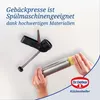 Hands holding a cookie press and dough. Anteprima dell’immagine prodotto