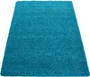 A teal shaggy rug is shown from a slightly elevated angle against a white background. Anteprima dell’immagine prodotto
