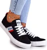 A close-up shot of a person wearing black Lee Cooper sneakers. Náhľad obrázku produktu