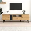 A modern TV stand with a wood grain finish and black accents is shown against a white wall. Podgląd zdjęcia produktu
