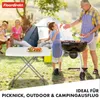 A family is having a picnic and barbecue in a park with a tent in the background. A portable table is set up with food. Voir les images du produit