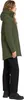 A woman wearing a green parka and black pants, shown from the side.