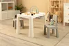 A children's table and chairs set in a room with shelves and a cubby unit. Náhled obrázku produktu