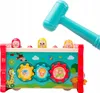 A close-up shot of a colorful, interactive toy for children, featuring a hammer and various animal-themed elements. Podgląd zdjęcia produktu