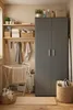 A laundry room with cleaning supplies and storage. Anteprima dell’immagine prodotto