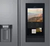 A close-up of a modern stainless steel refrigerator with a large touchscreen display. Produktbild-Vorschau
