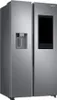 A modern, silver Samsung Family Hub refrigerator with a large black touchscreen display on the right door. Produktbild-Vorschau