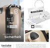 A collage of images showcasing a gold suitcase and its accessories, including luggage tags and a lock. Náhled obrázku produktu