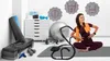A woman is sitting on a yoga mat in a room with various fitness equipment, with graphic icons above her head. Produktbild-Vorschau