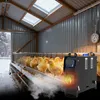 Chicks in a coop with a heater. Voir les images du produit
