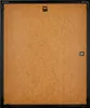 The back of a black picture frame with a brown backing board. Produktbild-Vorschau