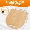 A bamboo cutting board with dimensions and compatibility information for Thermomix TM5/TM6. Voir les images du produit