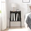 A bedside table with books and a lamp in a bedroom setting. Produktbild-Vorschau