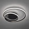A modern black ceiling light with LED illumination, featuring two intertwined rings, mounted on a gray ceiling. Voir les images du produit