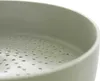 A close-up view of the interior of a pot with a perforated bottom. Anteprima dell’immagine prodotto