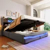 A modern bedroom with a bed that has its storage compartment open, revealing stored items and blue LED lighting. Podgląd zdjęcia produktu