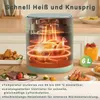 An air fryer cooking a whole chicken, with other food items and a drink on the side. Podgląd zdjęcia produktu